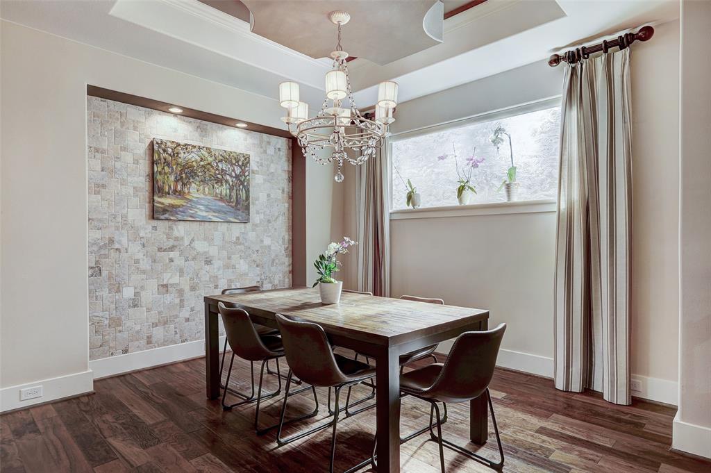 4501 Westlake Drive, Unit 23 Austin, TX 78746 - Photo 6 of 15 a view of a dining room with furniture window and wooden floor