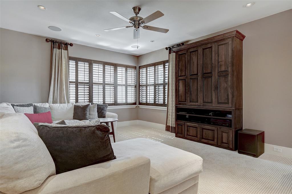 4501 Westlake Drive, Unit 23 Austin, TX 78746 - Photo 10 of 15 a living room with furniture ceiling fan and a window
