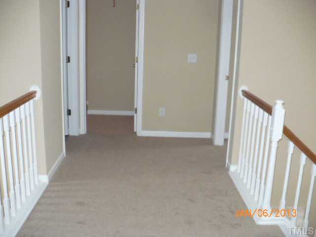 2512 Spruce Shadows Lane Raleigh, NC 27614 - Photo 12 of 22 a view of a hallway with entryway door