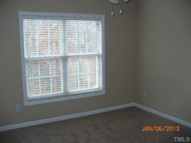 2512 Spruce Shadows Lane Raleigh, NC 27614 - Photo 13 of 22 an empty room with a window