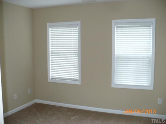 2512 Spruce Shadows Lane Raleigh, NC 27614 - Photo 14 of 22 an empty room with a window