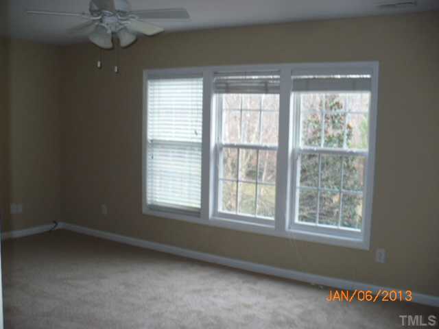 2512 Spruce Shadows Lane Raleigh, NC 27614 - Photo 16 of 22 a view of an empty room with a window
