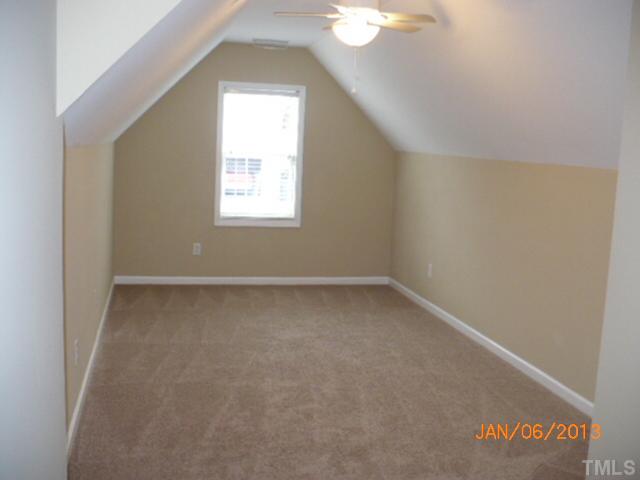 2512 Spruce Shadows Lane Raleigh, NC 27614 - Photo 19 of 22 an empty room with a window