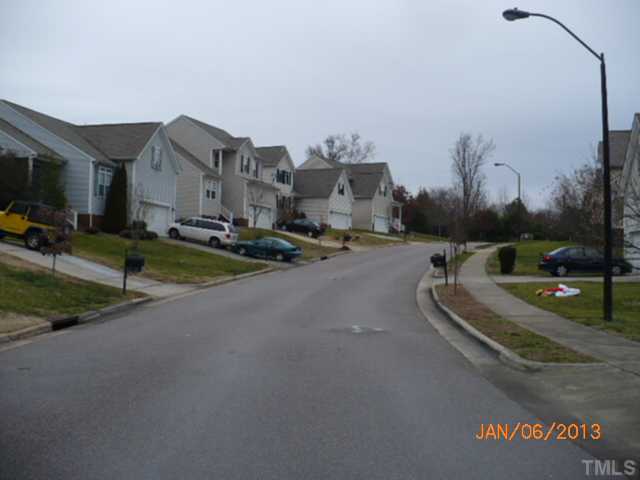 2512 Spruce Shadows Lane Raleigh, NC 27614 - Photo 22 of 22 a view of a street with cars