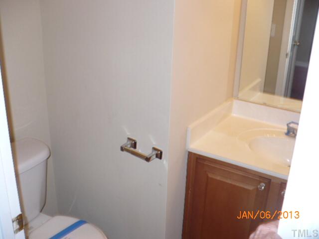 2512 Spruce Shadows Lane Raleigh, NC 27614 - Photo 9 of 22 a bathroom with a sink and a vanity