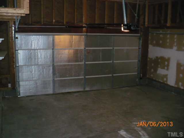 2512 Spruce Shadows Lane Raleigh, NC 27614 - Photo 10 of 22 a room with wooden floor and a cabinet