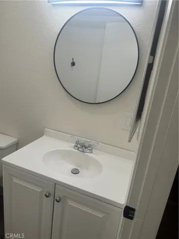 a bathroom with a sink and mirror