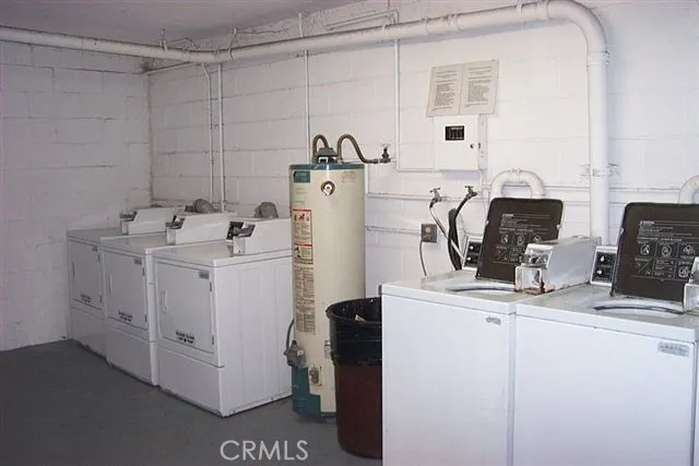 a utility room with closet dryer and washer