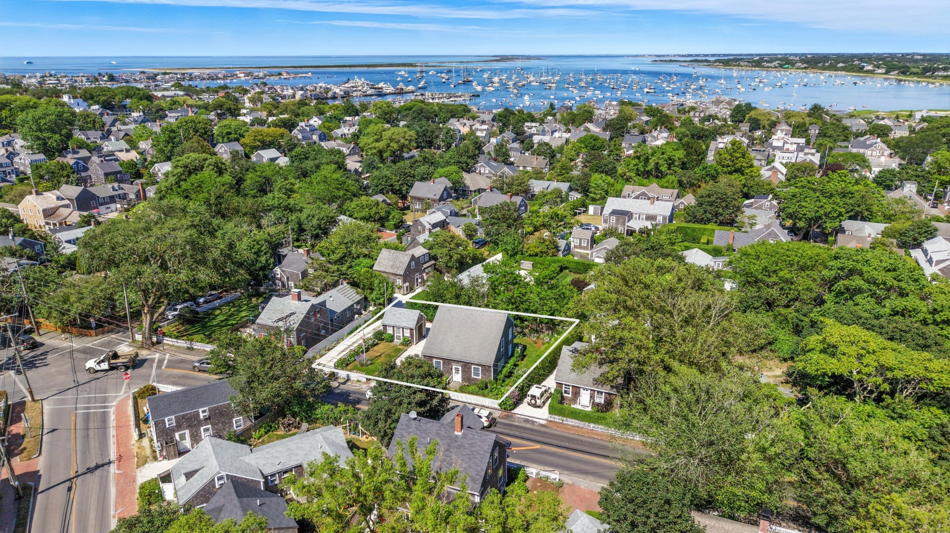 52 Pleasant Street Nantucket, MA 02554 - Photo 1 of 36 an aerial view of a house with a yard