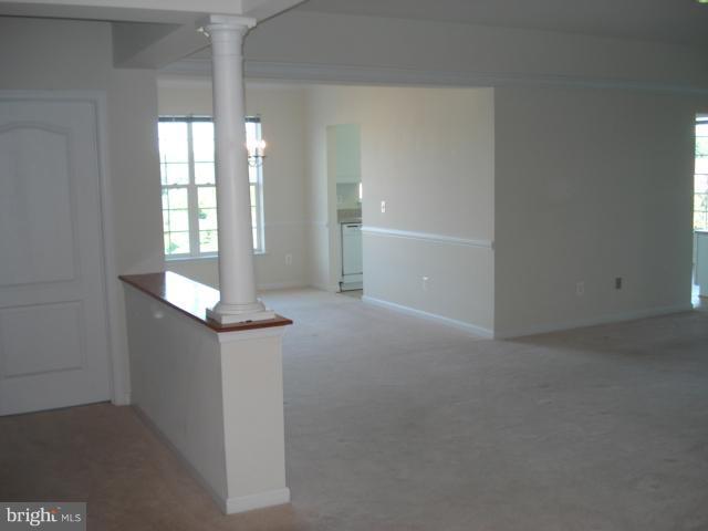 7305 Maplecrest Road, Unit 403 Elkridge, MD 21075 - Photo 21 of 30 an empty room with windows