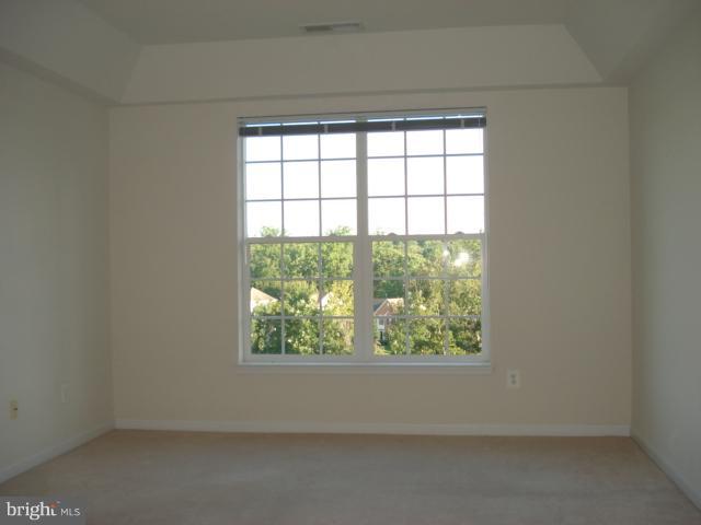 7305 Maplecrest Road, Unit 403 Elkridge, MD 21075 - Photo 29 of 30 an empty room with a window