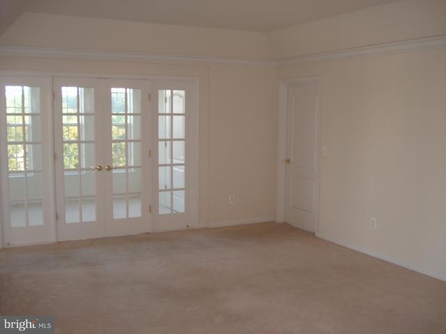 7305 Maplecrest Road, Unit 403 Elkridge, MD 21075 - Photo 6 of 30 an empty room with windows
