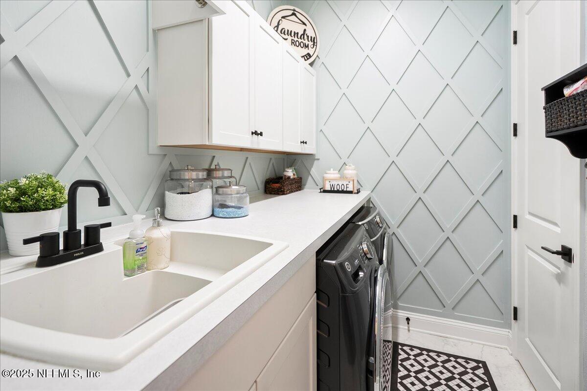 470 Parkbluff Circle Ponte Vedra, FL 32081 - Photo 18 of 42 a kitchen with a sink a stove and a microwave