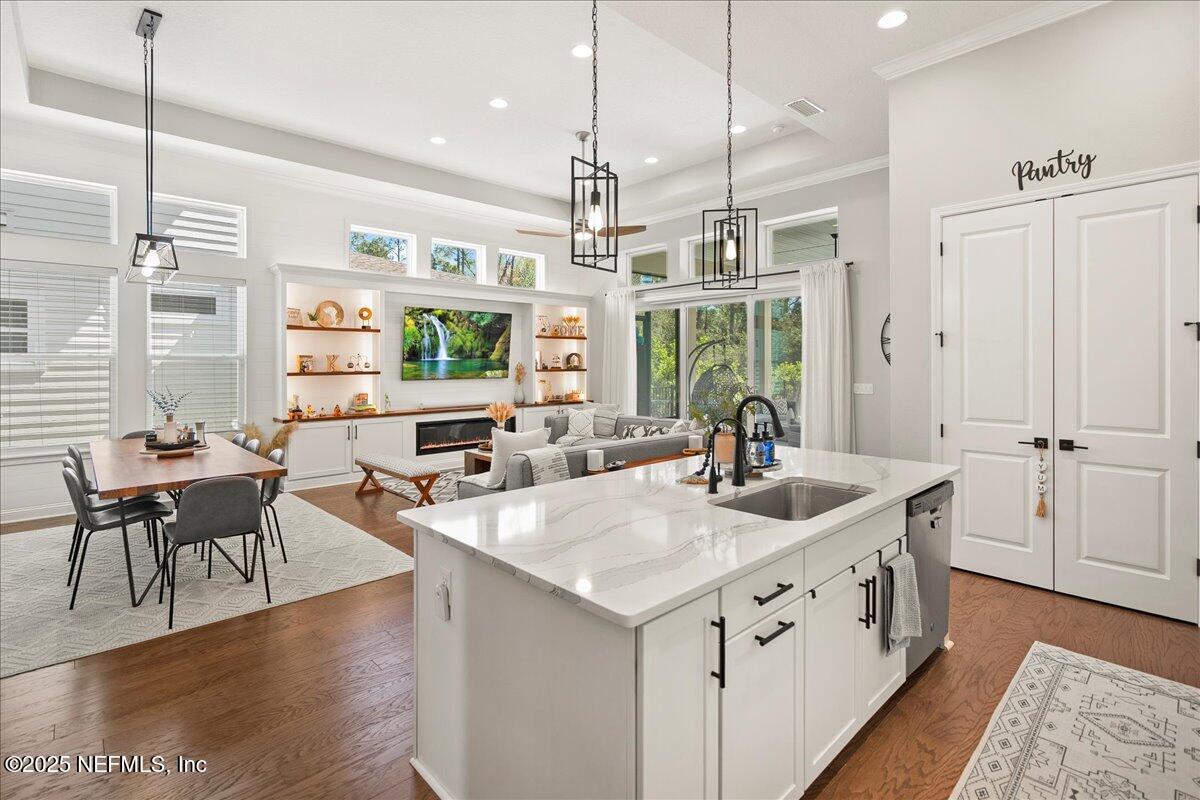 470 Parkbluff Circle Ponte Vedra, FL 32081 - Photo 26 of 42 a open kitchen with stainless steel appliances granite countertop a sink stove and wooden floor