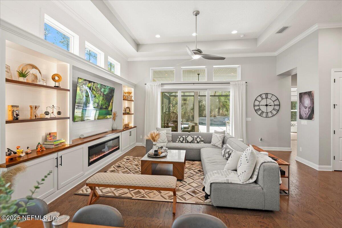 470 Parkbluff Circle Ponte Vedra, FL 32081 - Photo 28 of 42 a living room with furniture fireplace and a large window