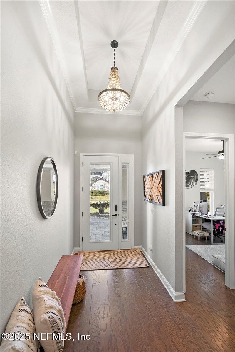 470 Parkbluff Circle Ponte Vedra, FL 32081 - Photo 3 of 42 a spacious bedroom with a bed and a chandelier