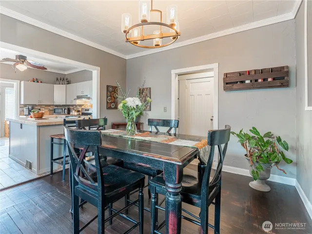 a view of a dining room with furniture window and wooden floor