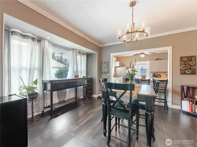 a kitchen with kitchen island a counter space a sink a stove and refrigerator