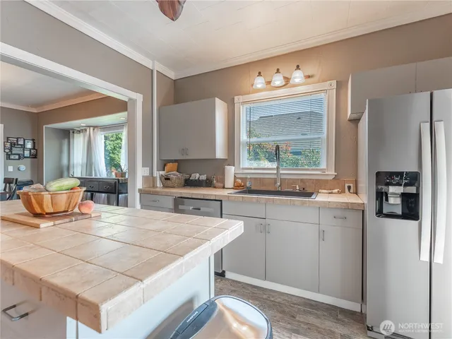 a kitchen with a stove and a refrigerator