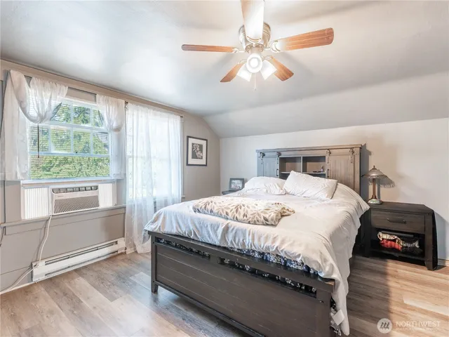 a bed room with a bed and a television