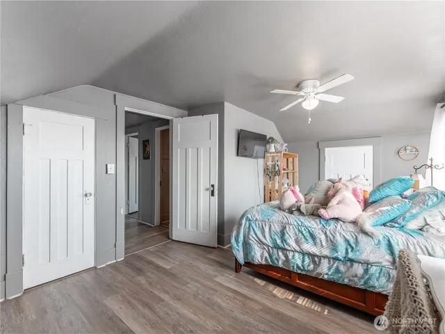 a bedroom with a bed and cabinets