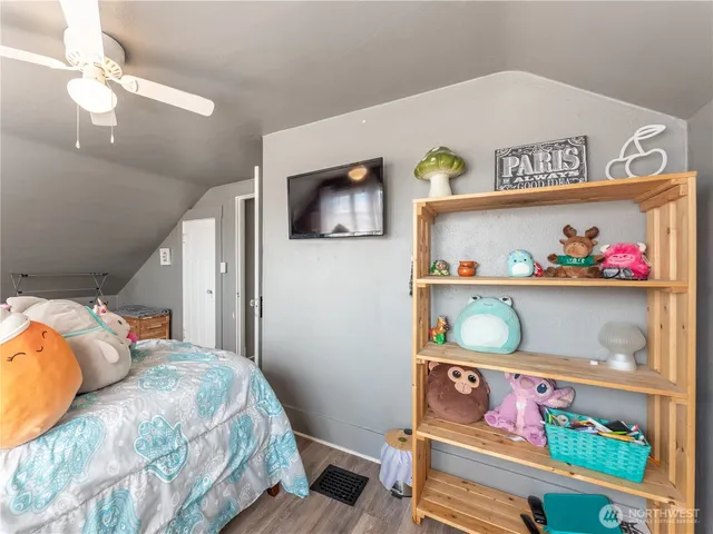 a bedroom with a bed and a mirror