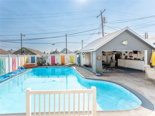 a view of a living room and kitchen