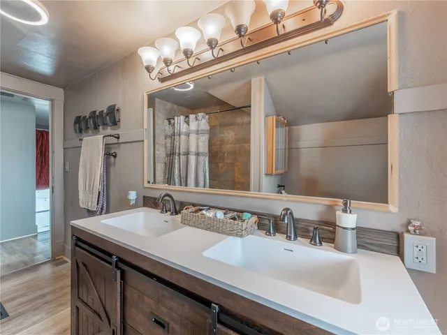 a outdoor space with lots of tables a chair and potted plant