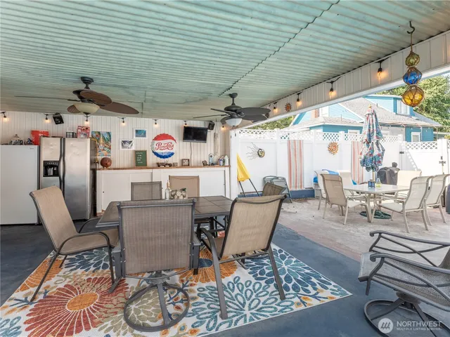 a view of a patio with a dining table and chairs
