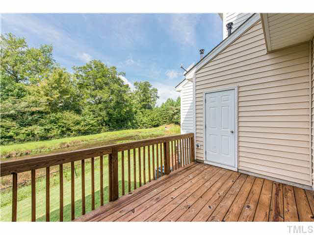 5605 Amanda Lynn Lane Raleigh, NC 27613 - Photo 22 of 25 a view of balcony with wooden floor