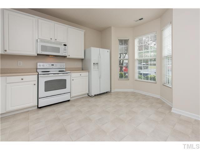 5605 Amanda Lynn Lane Raleigh, NC 27613 - Photo 4 of 25 a view of a kitchen with electric appliances