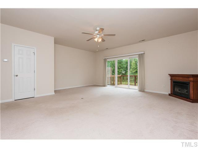 5605 Amanda Lynn Lane Raleigh, NC 27613 - Photo 9 of 25 a view of a livingroom with a ceiling fan and window