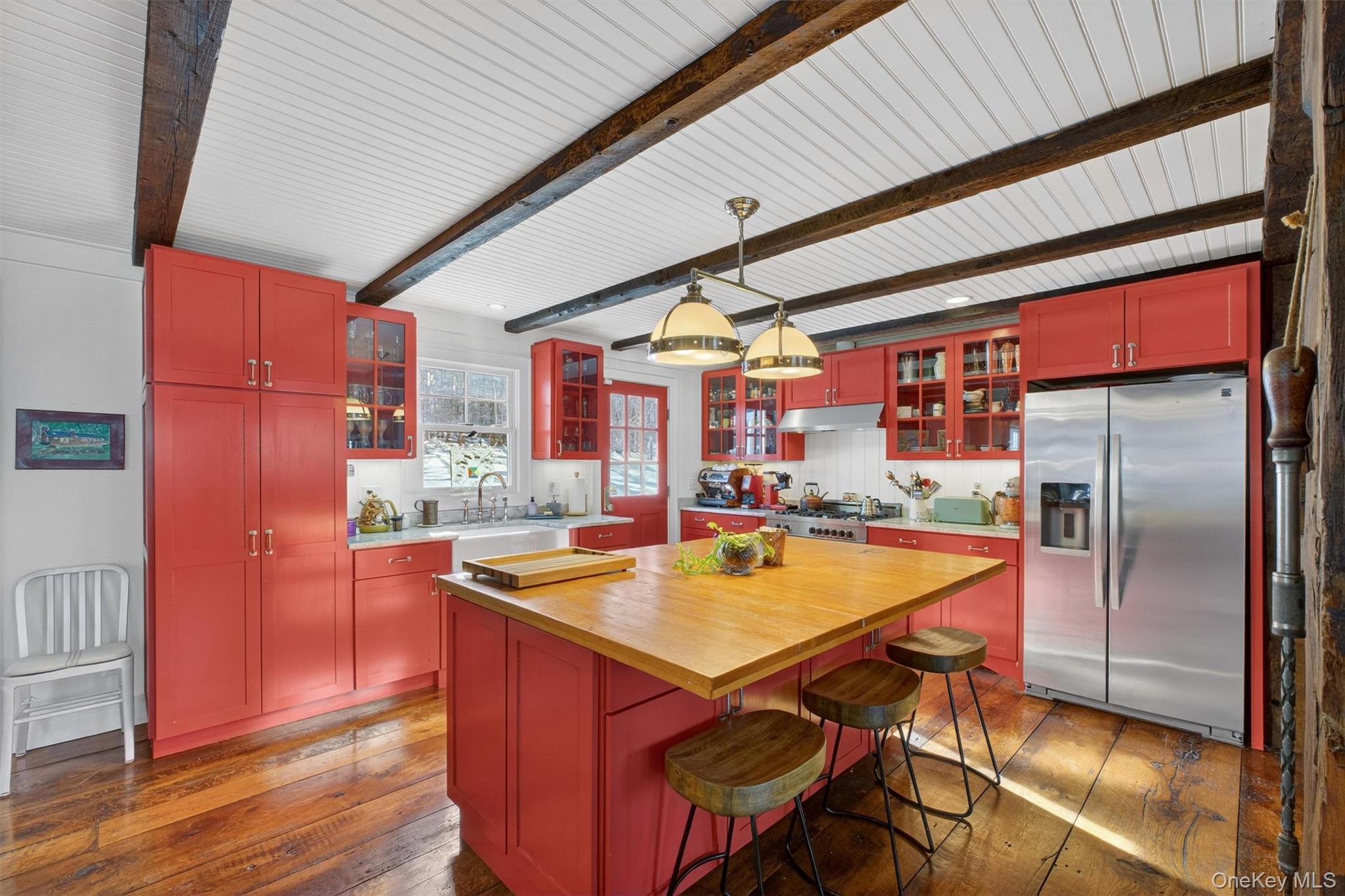 1125 Old Quaker Hill Road Pawling, NY 12564 - Photo 13 of 38 a kitchen with stainless steel appliances granite countertop a refrigerator a sink and a stove