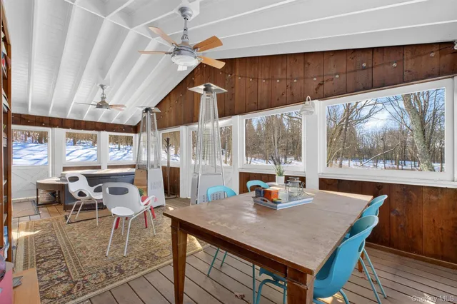a view of a patio with table and chairs