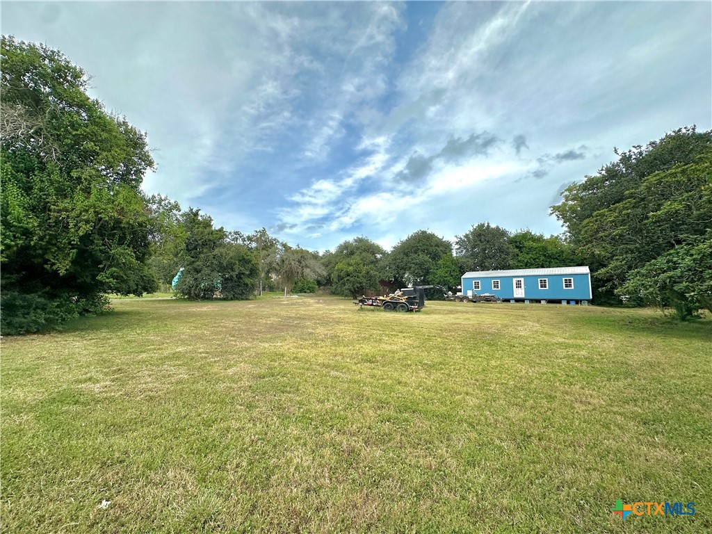 400 West Church Street Victoria, TX 77901 - Photo 1 of 10 a view of a big yard with an trees