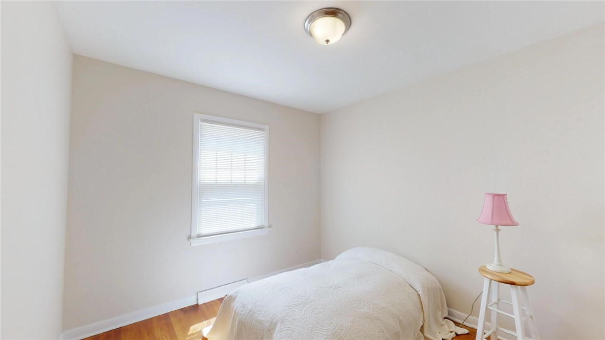 9 Maple Court Decatur, IL 62526 - Photo 17 of 25 a bedroom with a bed and a chandelier