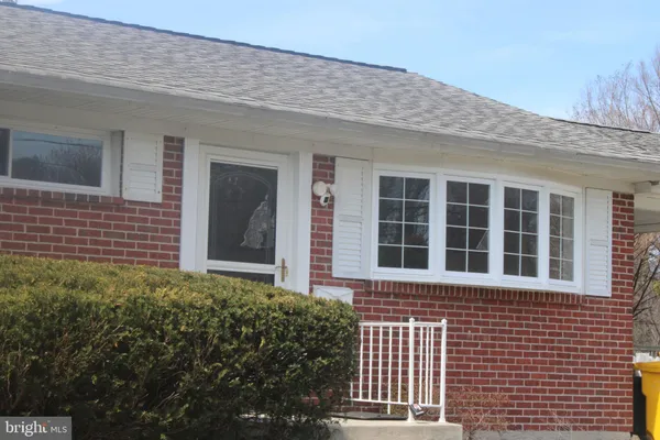a view of outdoor space with a garden and signage