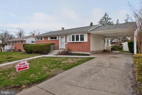 a kitchen with stainless steel appliances a stove a sink and a microwave