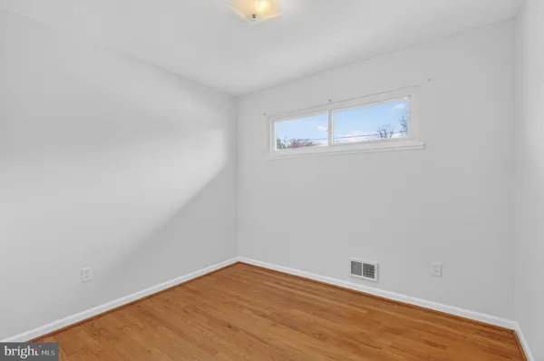 a bathroom with a sink mirror vanity and toilet