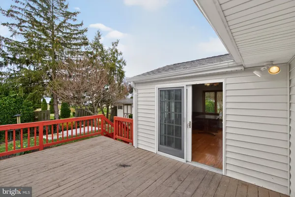 a balcony with wooden floor