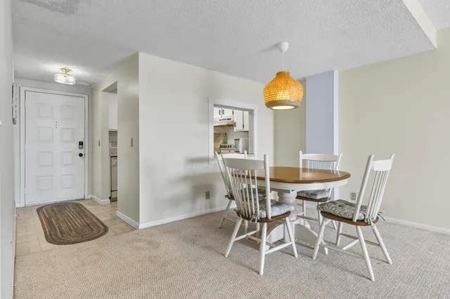a view of a balcony with two chairs and a table
