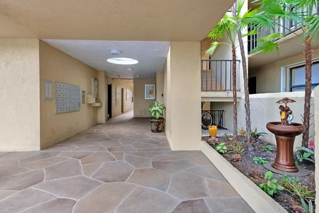 a living room with furniture and white walls