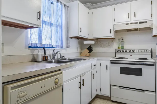a room with furniture pool table and windows