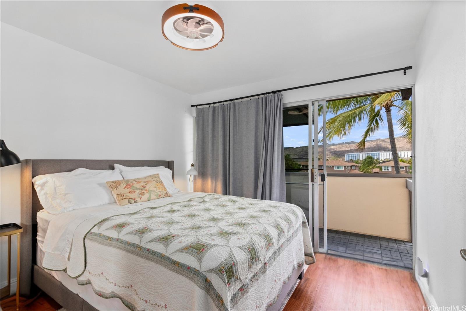 444 Lunalilo Home Road, Unit 327 Honolulu, HI 96825 - Photo 11 of 15 a bedroom with a bed and a window