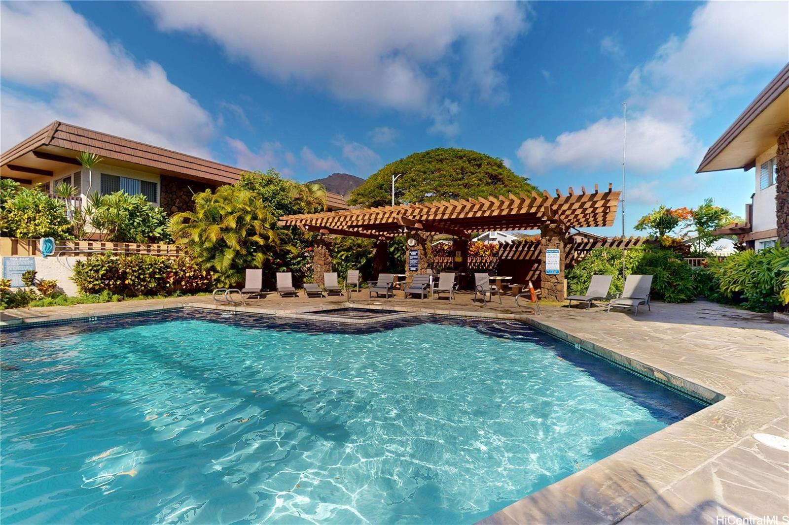 444 Lunalilo Home Road, Unit 327 Honolulu, HI 96825 - Photo 14 of 15 a view of a swimming pool with an outdoor seating