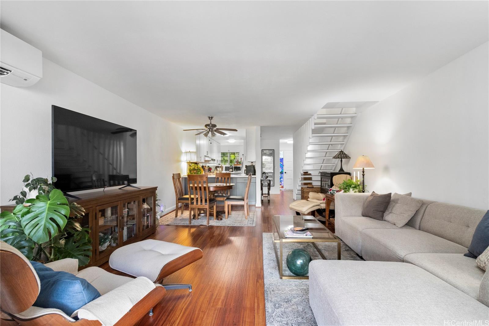 444 Lunalilo Home Road, Unit 327 Honolulu, HI 96825 - Photo 2 of 15 a living room with furniture and a flat screen tv