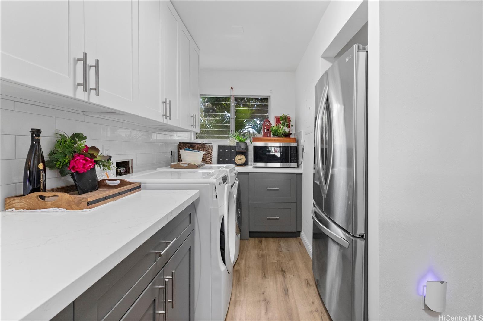 444 Lunalilo Home Road, Unit 327 Honolulu, HI 96825 - Photo 7 of 15 a kitchen with a sink cabinets and stainless steel appliances