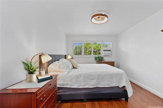 a bedroom with a bed and dresser