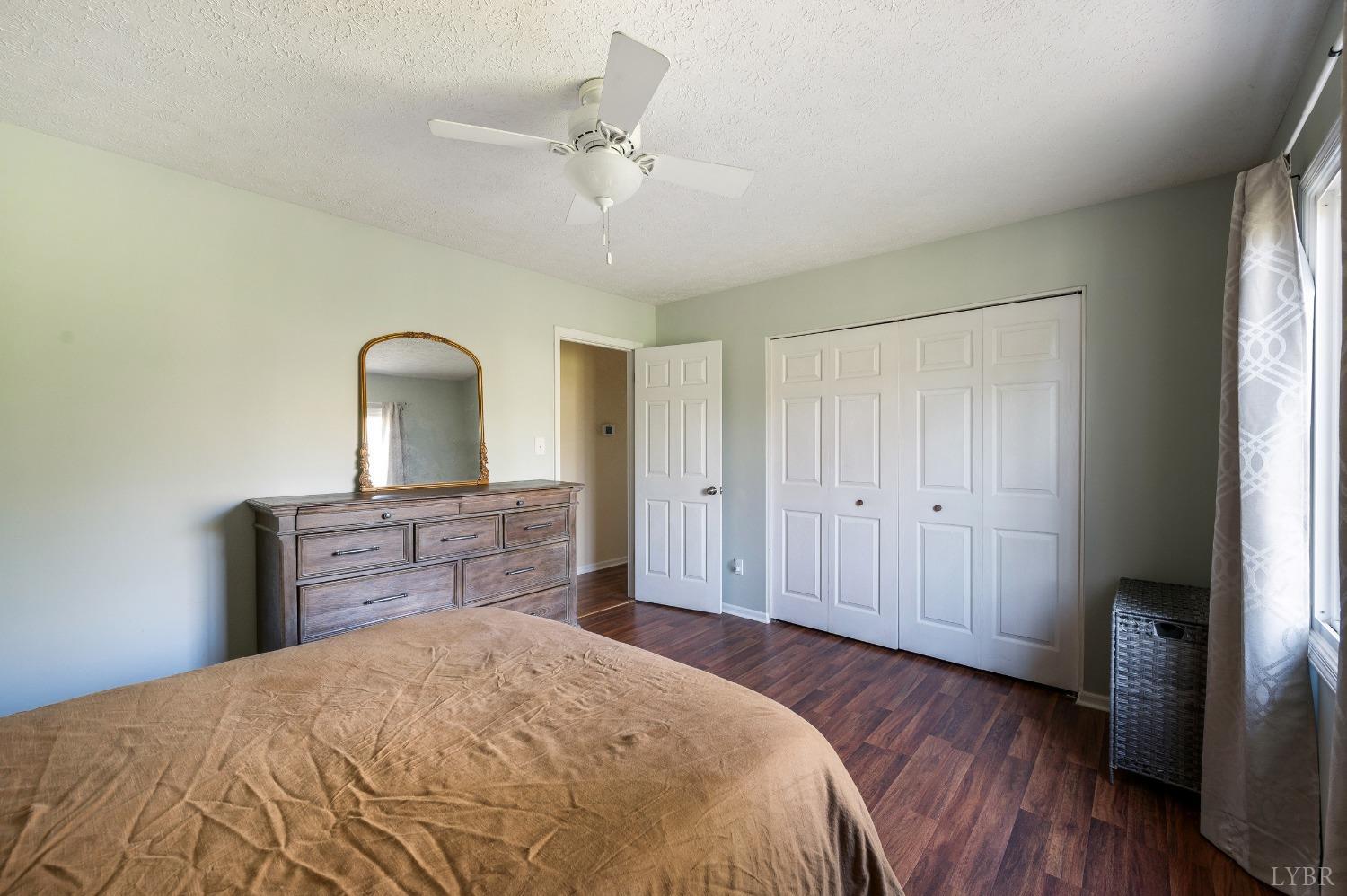 503 Sweeney Circle Forest, VA 24551 - Photo 15 of 50 a bedroom with a bed and wooden floor