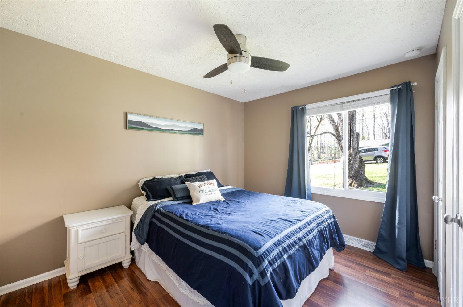 503 Sweeney Circle Forest, VA 24551 - Photo 16 of 50 a bedroom with a bed and wooden floor